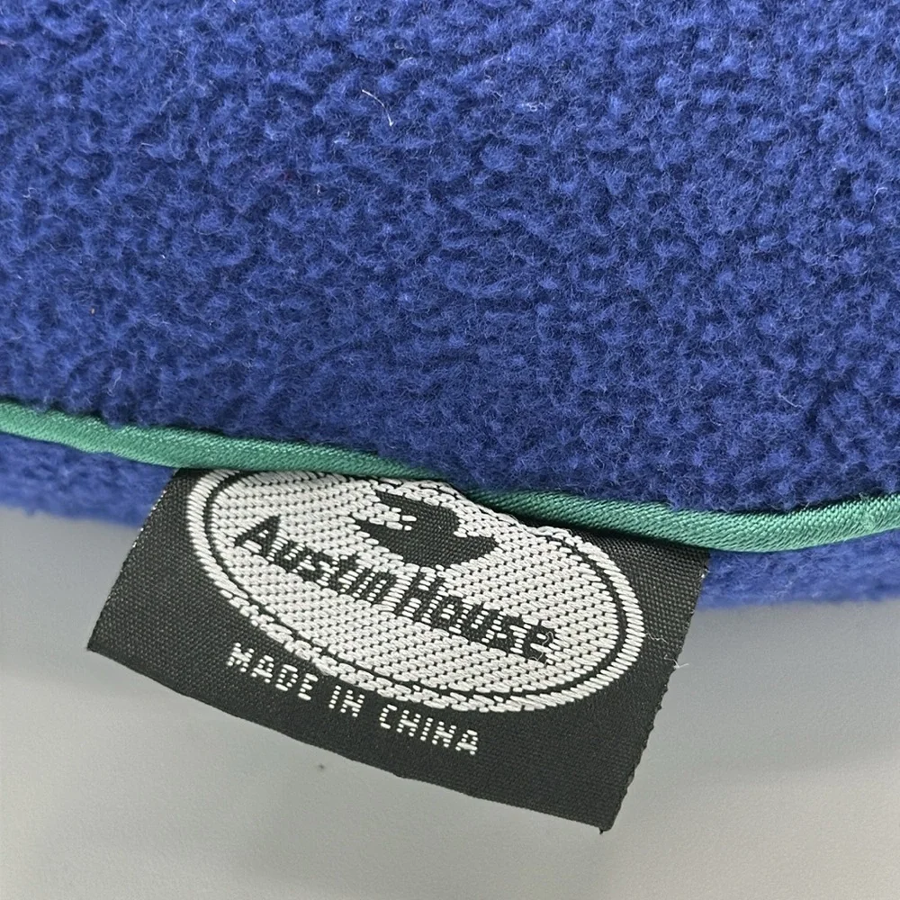 Austin House blue neck travel pillow with green piping